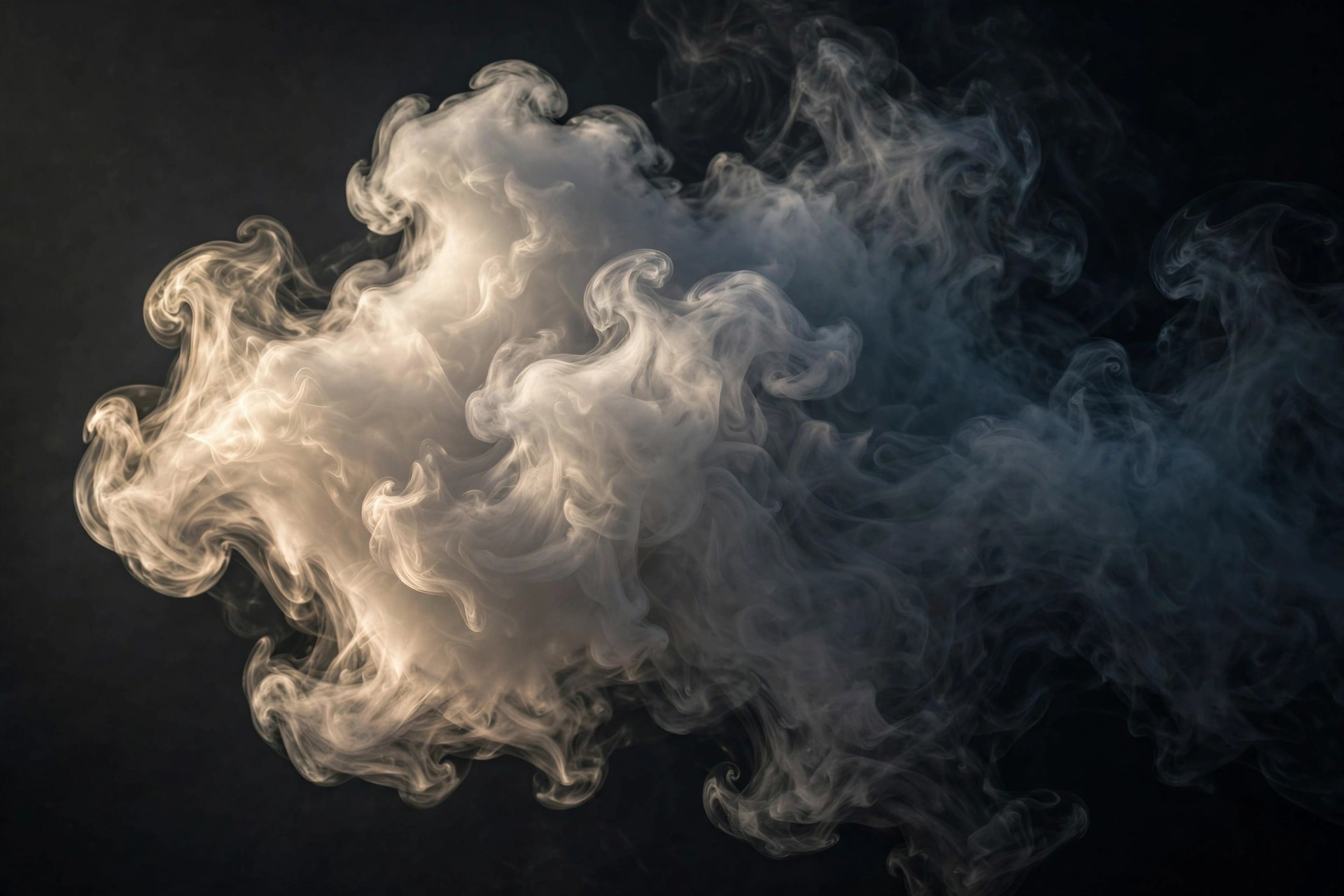 Dense vapor cloud produced by high-VG e-liquid against a dark background