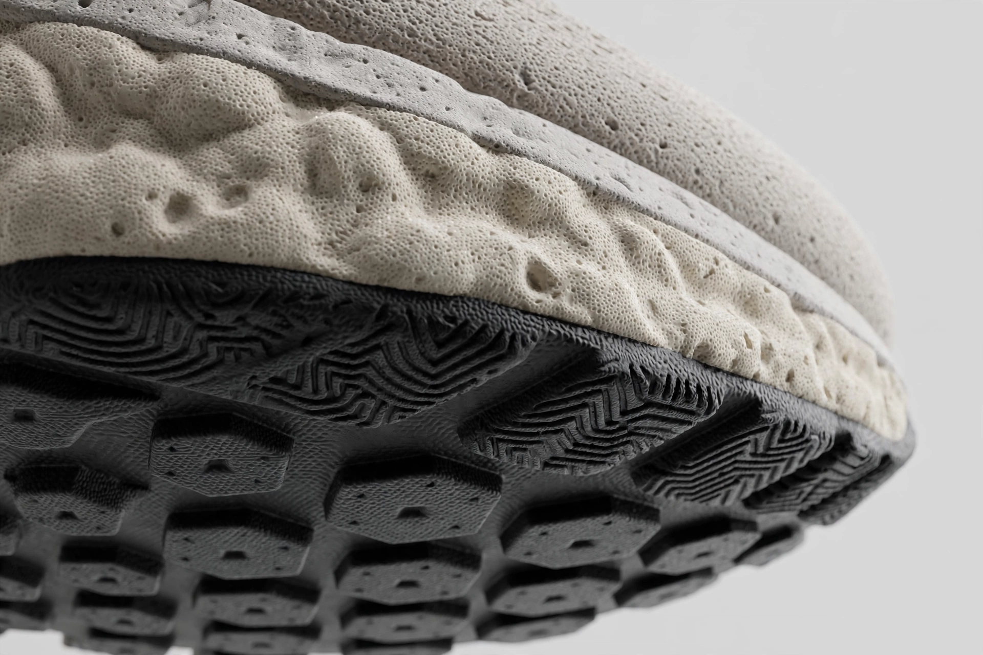 Cushioned midsole and tread pattern of a running shoe sole close up