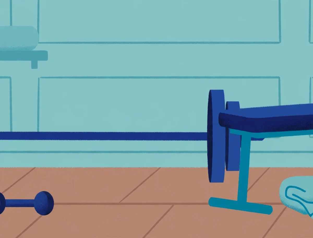 Home gym setup for beginner strength training with dumbbells, barbell, kettlebell and workout bench